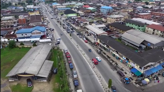 Aerial view across an urban road in Warri